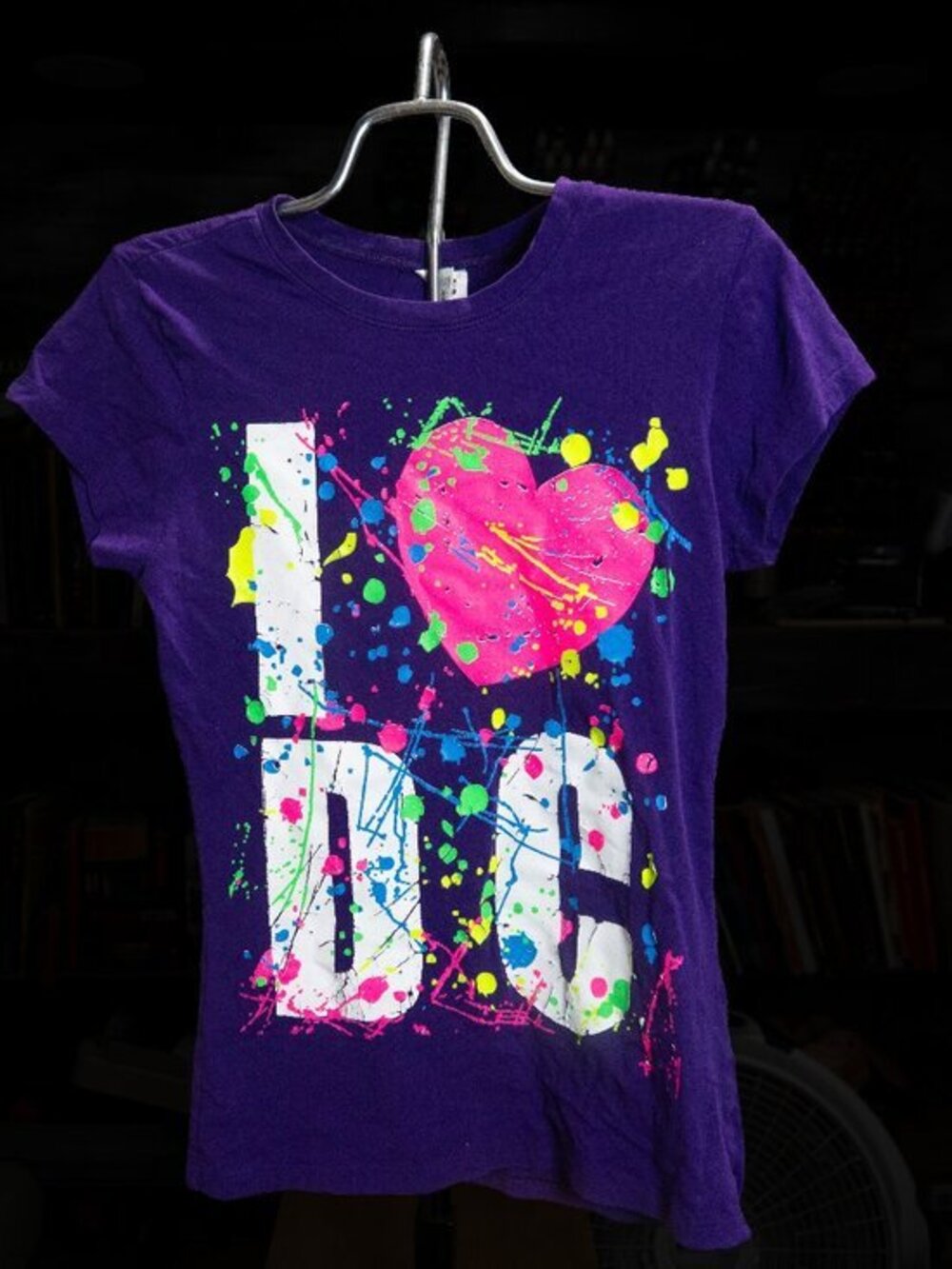 A purple, short sleeved tee-shirt, in XL, baby cut w/ Colorful graphic